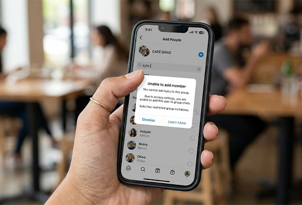 a phone showing unable to add a member in a group chat